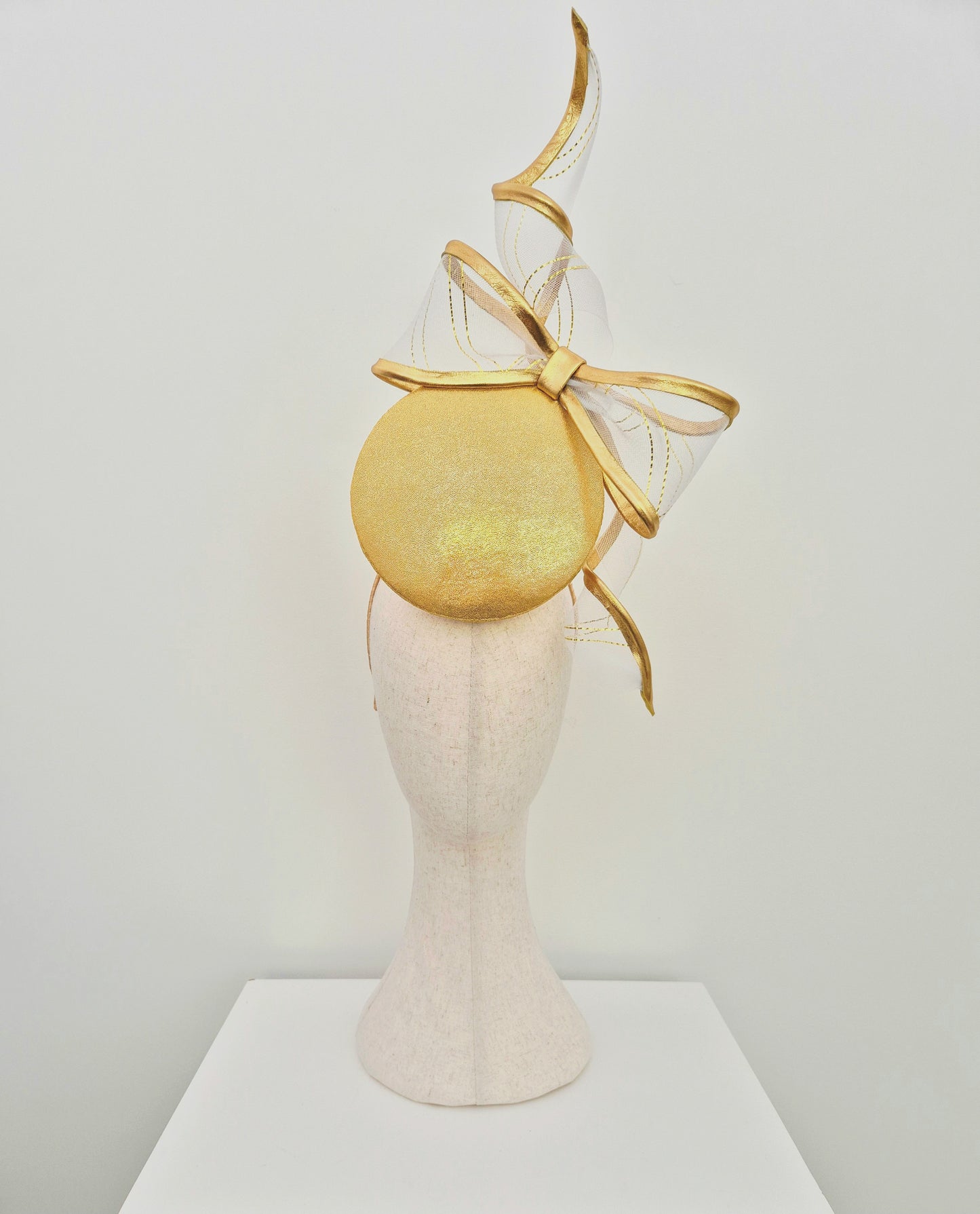 Miss Gwyneth. Womens Gold button percher headpiece with crinoline bow swirl