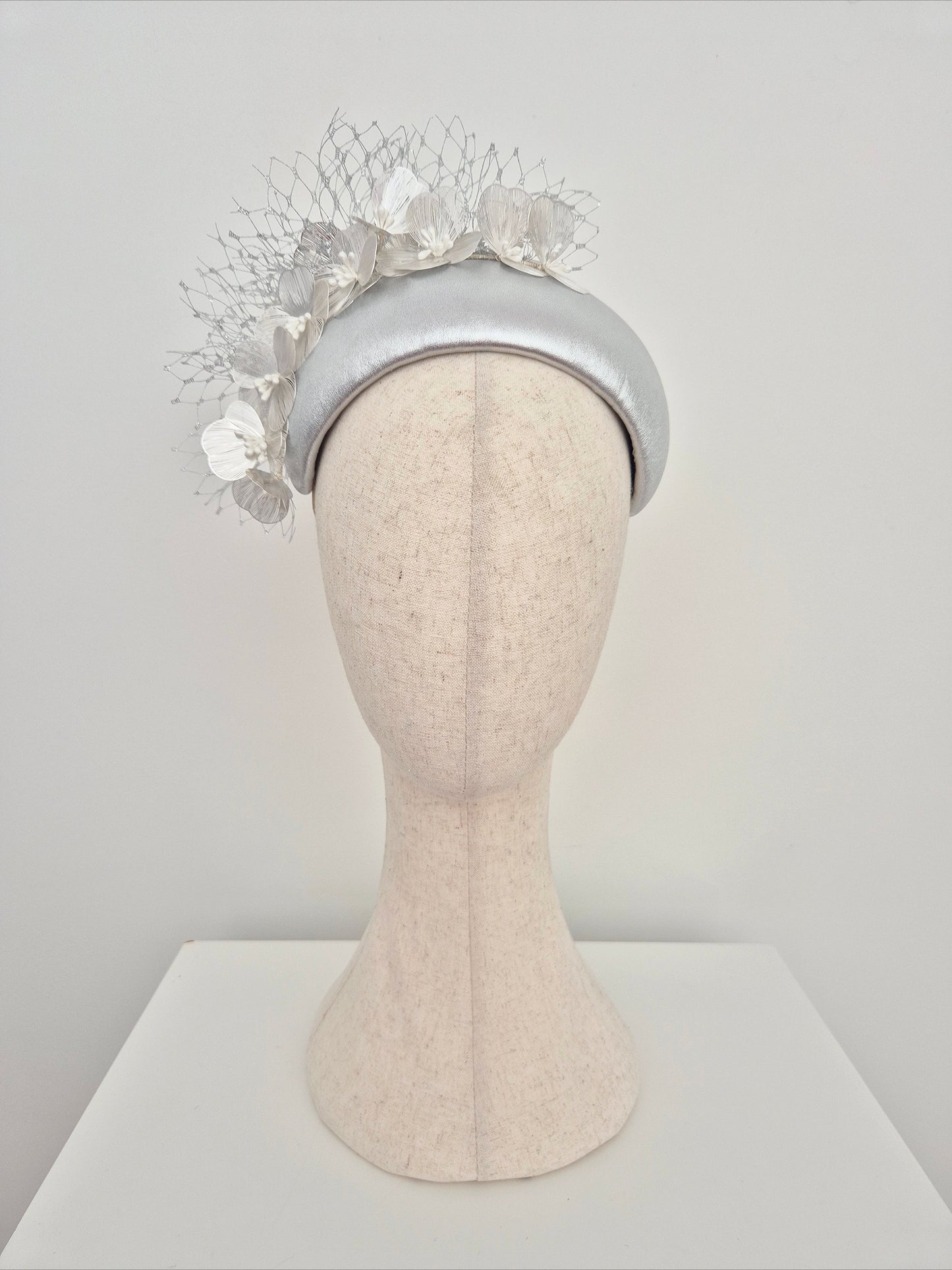 Miss Kinsley. Womens Silver leather bandeau headpiece with silver flowers