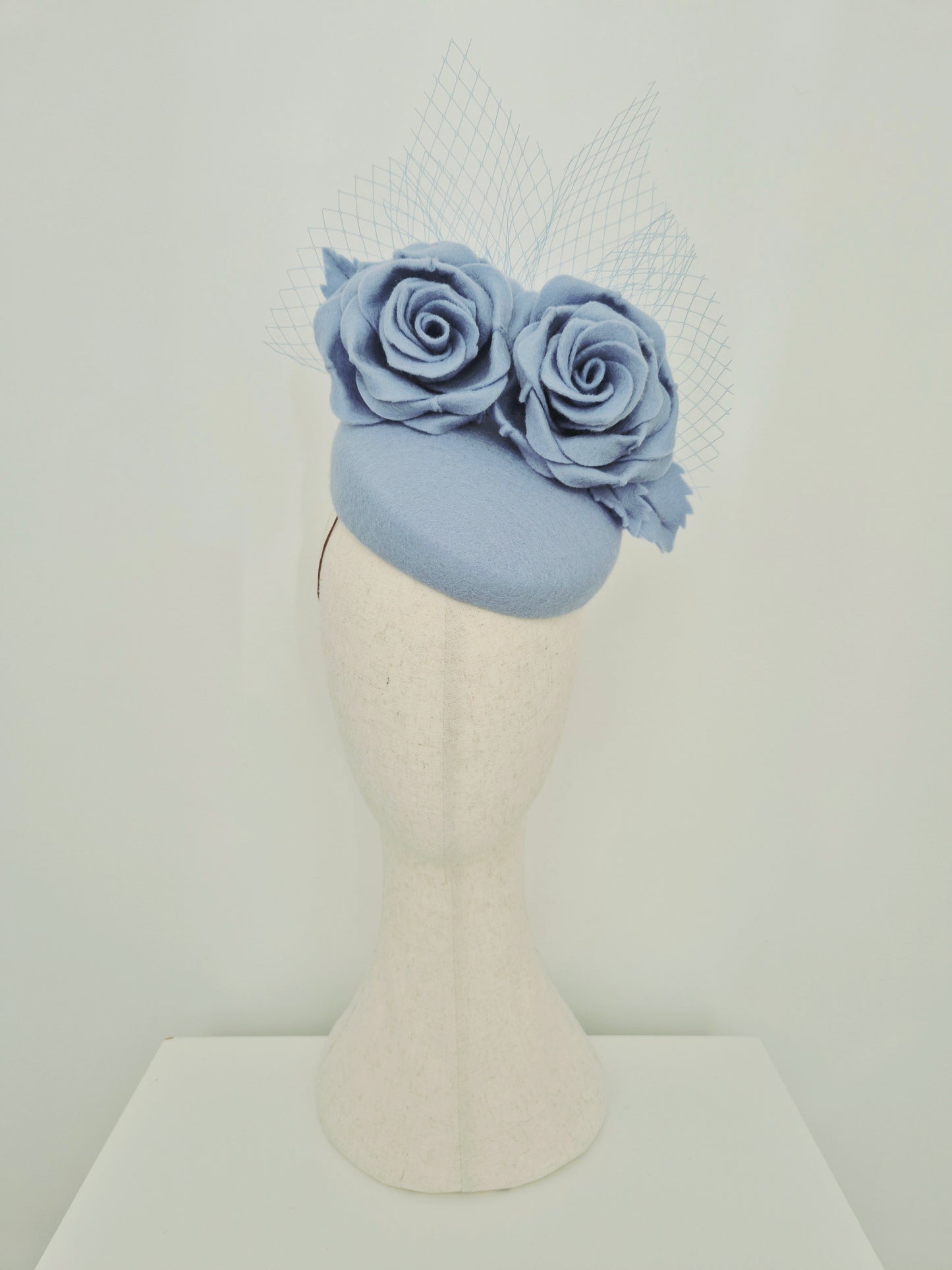 Miss Laura. Womens Dusty Blue felt slanted pillbox headpiece with roses and veiling