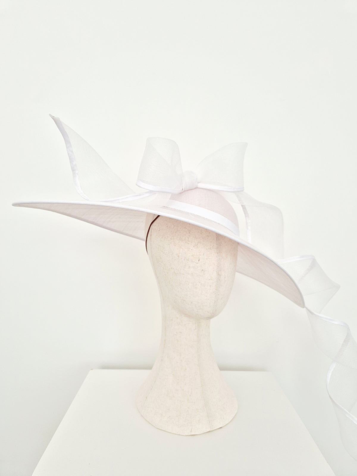 Miss Bonnie. Womens white sinamay straw hat with trailing bow and tails