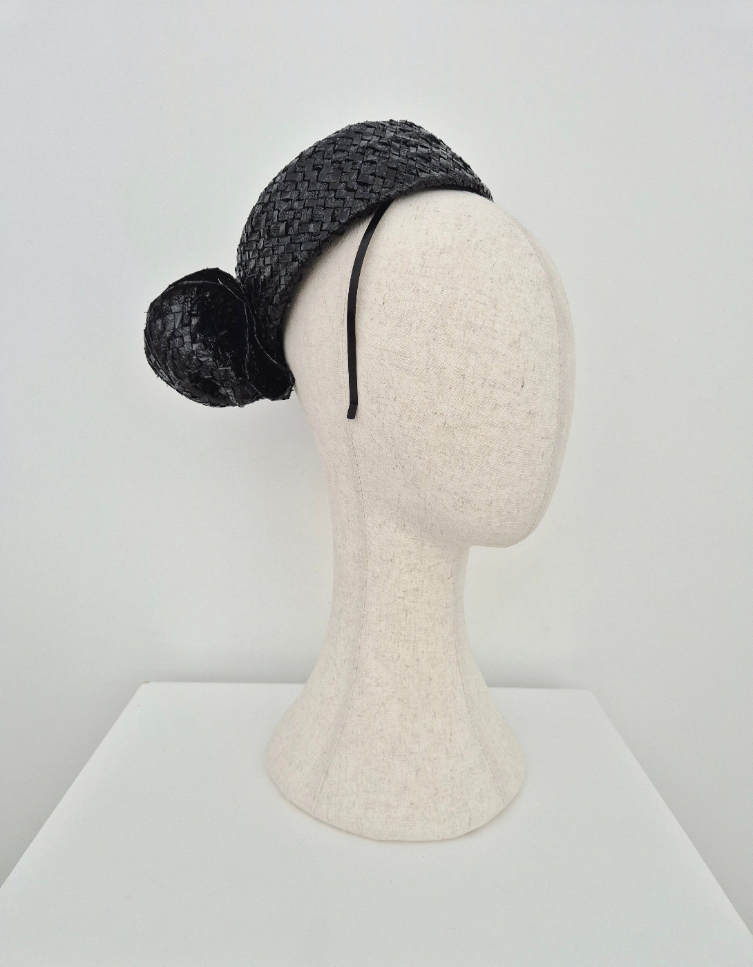 side view black vintage straw headpiece with bow