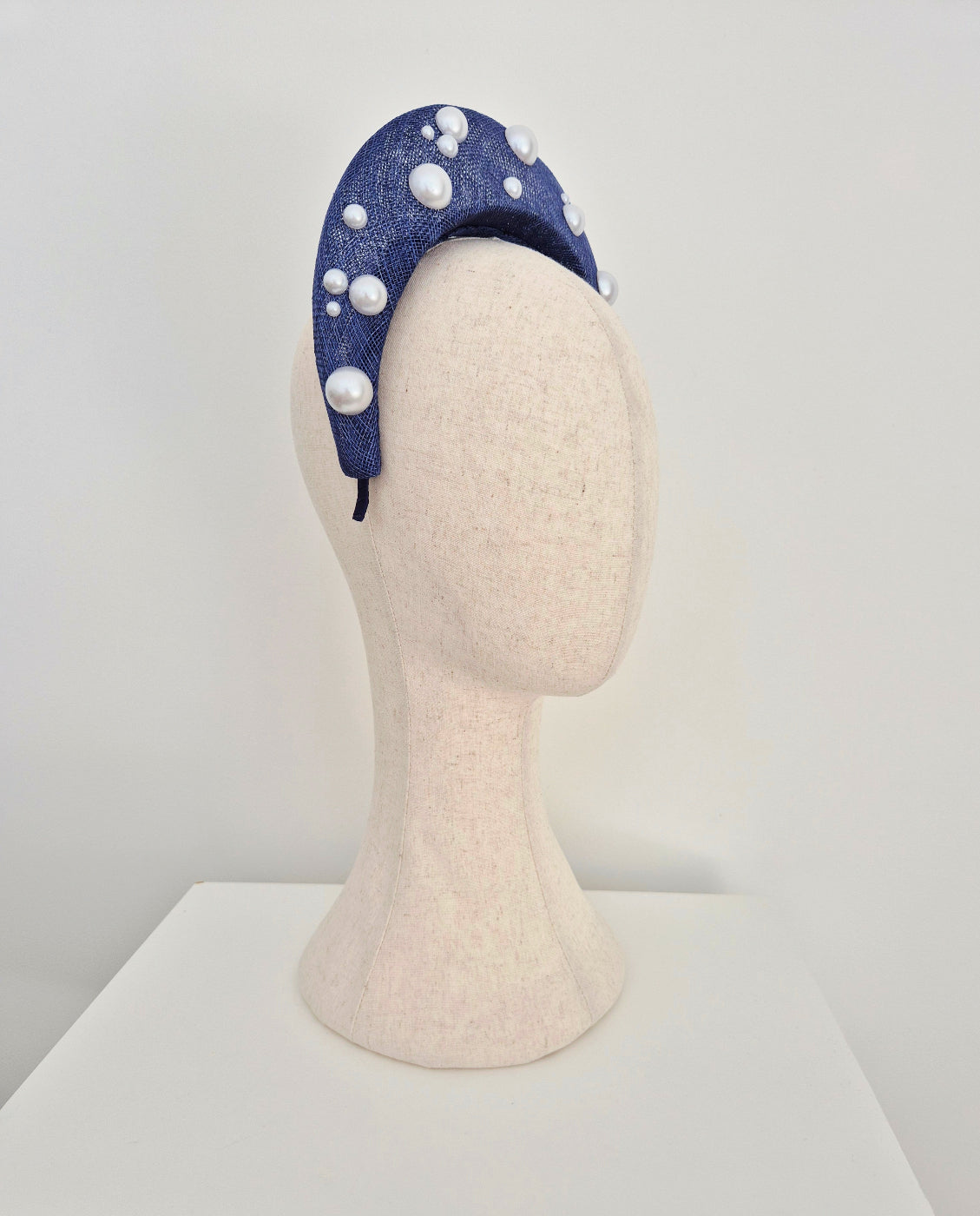 side view light navy blue straw halo headpiece with pearls