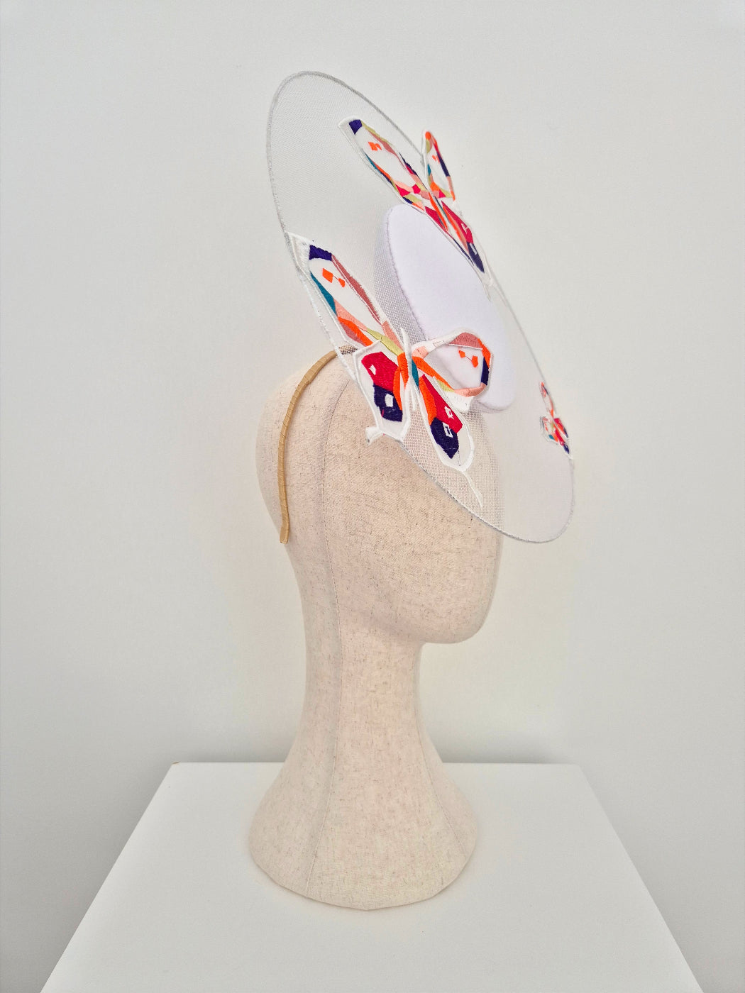 side view white percher headpiece with butterflies