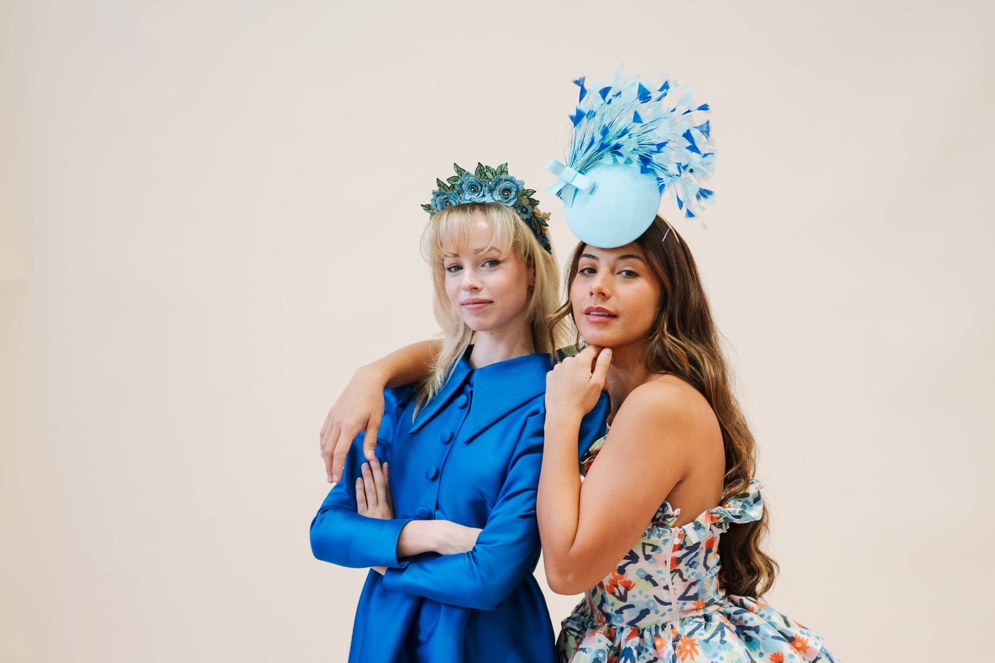 two models wearing blue headpiece