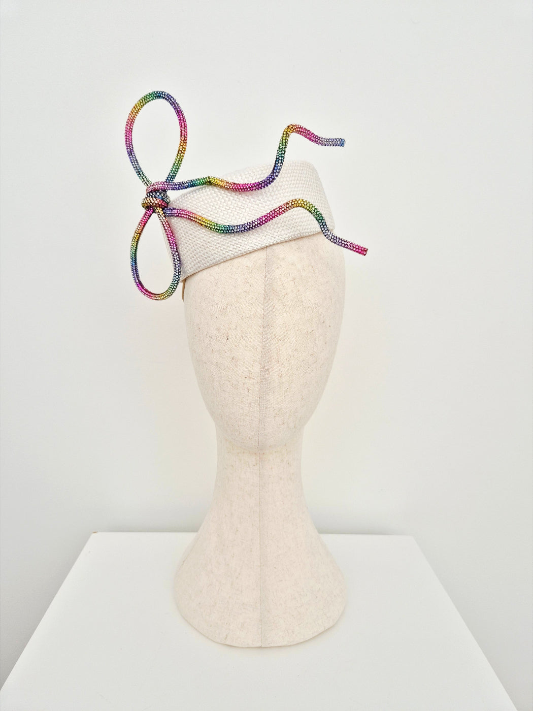 white pillbox with rhinestone bow