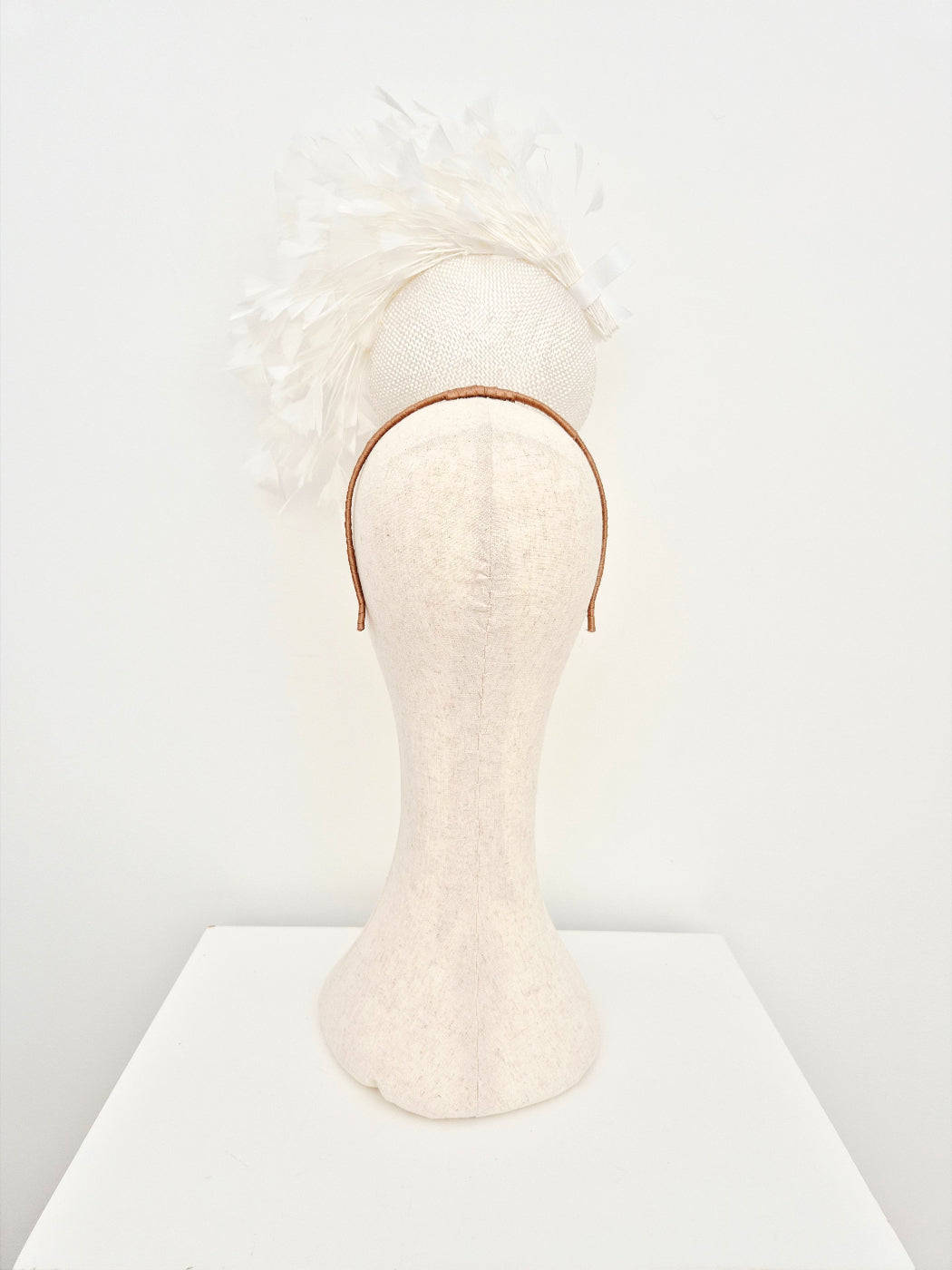 white straw percher headpiece with feathers back view